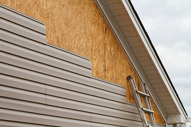 Professional Siding Installation technician working in New Paris, IN
